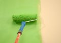 Green wall painting roller Royalty Free Stock Photo