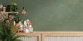 Green wall panelling with wooden shelf in kitchen room