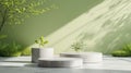 Three Cement Planters in Front of Green Wall