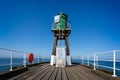 Green warning beacon on Whitby pier