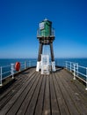 Green warning beacon on Whitby pier