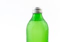 Green water or lemonade bottle with condensation drops isolated Royalty Free Stock Photo