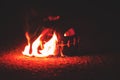 Green watermelon burns with fiery flame on the scary holiday halloween