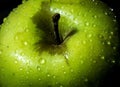 Green wet apple with drops closeup Royalty Free Stock Photo