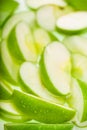 Green wet apple slices. Food background Royalty Free Stock Photo