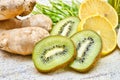 Green wheat, lemon and ginger, kiwi for a fresh juice or detox smoothie Royalty Free Stock Photo