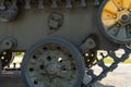 Green wheels and tracks of old military equipment, tanks, artillery installations and anti-tank self-propelled vehicles close-up. Royalty Free Stock Photo