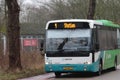 Green and white bus of arriva for city line 1 in the town of Gouda.