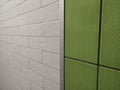 green and white ceramic tiles with curb under brick