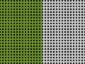 Green and white dots on black create a divided pattern. Royalty Free Stock Photo