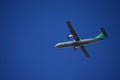 Green and White Double Helix Regional Airplane Flying Left