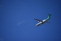 Green and White Double Helix Regional Airplane Flying Left