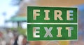 Green and white fire exit sign Royalty Free Stock Photo