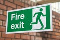 Green and White Fire Exit Sign Royalty Free Stock Photo