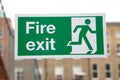 Green and White Fire Exit Sign Royalty Free Stock Photo