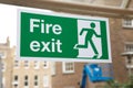 Green and White Fire Exit Sign Royalty Free Stock Photo