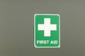 Green and white First Aid sign