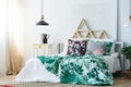 Green and white floral bedclothes Royalty Free Stock Photo