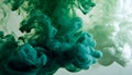 Green and white ink diffusing in water, forming swirling clouds. Royalty Free Stock Photo