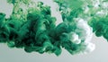 Green and white ink diffusing in water, forming swirling clouds. Royalty Free Stock Photo