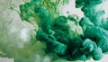 Green and white ink diffusing in water, forming swirling clouds. Royalty Free Stock Photo