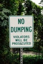 "No Dumping" warning sign, violators will be prosecuted