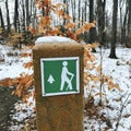 A GREEN, WHITE AND ORANGE TRAIL GUIDES HIKERS THROUGH NORTHEAST OHIO