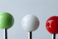 Green, white and red pin heads of glass Royalty Free Stock Photo