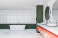 Green and white tile bathroom interior