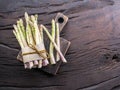 Green and white types of asparagus sprouts on wooden table. Top view