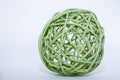 Green wicker reed like ornament or decoration ball on an isolated white background. Fall or winter season Royalty Free Stock Photo