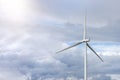 Green wind energy. Windmills for the production of renewable electricity. Windmills in the field, produce electricity on Royalty Free Stock Photo