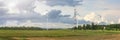 Green wind energy. Windmills for the production of renewable electricity. Windmills in the field, produce electricity on Royalty Free Stock Photo