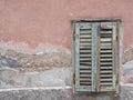 Green window shutter on the facade of an old house Royalty Free Stock Photo