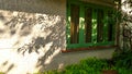 Green window and tree shade in the garden Royalty Free Stock Photo