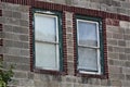 Green Windows Against Red Trim Royalty Free Stock Photo