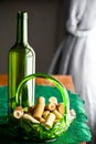 Green Wine Bottle  Wine Corks in Green Glass Basket Royalty Free Stock Photo