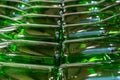 Green wine bottles filled with white wine stacked