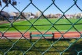 Green wire fence at the football pitch close up view Royalty Free Stock Photo