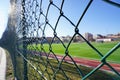 Green wire fence at the football pitch close up view Royalty Free Stock Photo