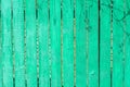 Old wooden green background of boards with cracked and paint. Fence. Wooden texture. Royalty Free Stock Photo