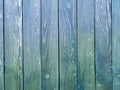 Green wood texture background. .Old ragged painted fence. Royalty Free Stock Photo