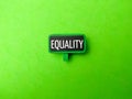 Green wooden board with the word EQUALITY Royalty Free Stock Photo