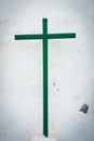 Green wooden cross