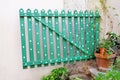 Green wooden decorative fence with floral flower elements and details / Part of the garden. Royalty Free Stock Photo