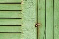 Green wooden door with padlock Royalty Free Stock Photo
