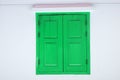 Green Wooden door on white wall texture background - abstract surface with copy space Royalty Free Stock Photo