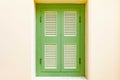 Green wooden door and white yellow cement wall Royalty Free Stock Photo