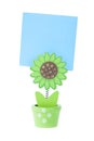 Green Wooden Flower Holds a Blue Note