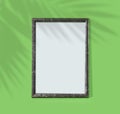 Green wooden frame on  monochrome background. Simple mockup for design. Copy space Royalty Free Stock Photo